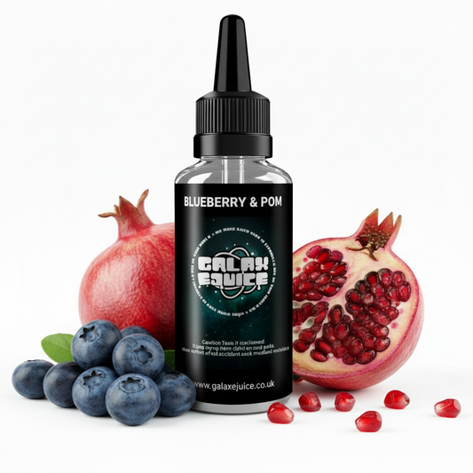 Bottle of Galax-E-Juice Blueberry & Pomegranate E-Liquid 100ml Shortfill with blueberries and pomegranate on a white background